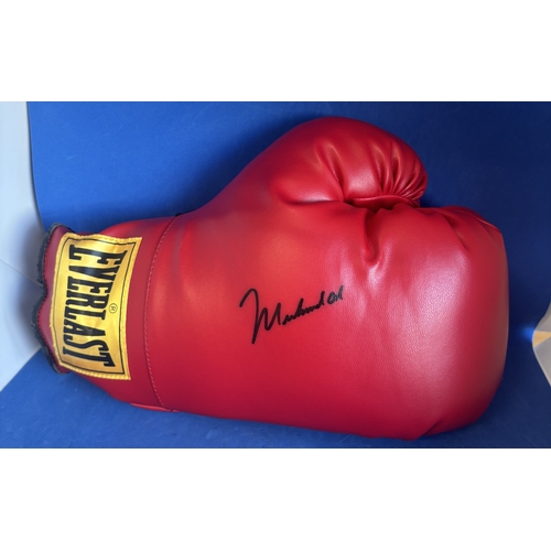 100 - Muhammad Ali signed red Everlast boxing glove.