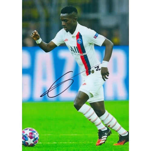 103 - Idrissa Gueye signed 12x8 inch colour photo pictured in action for Paris St Germain in France. Good ... 