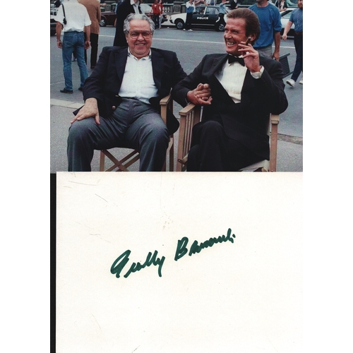 38 - Cubby Brocolli signed 6x4inch white card with accompanying colour photo pictured with Roger Moore.