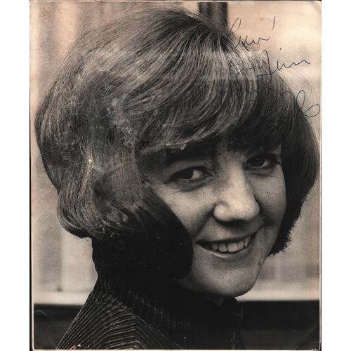 56 - Cilla Black signed 12x10inch black and white photo.  Showing signs of age.  Dedicated.