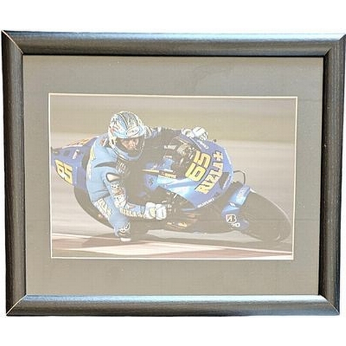 67 - Loris Capirossi 16x12 inch framed and mounted colour photo. Unsigned. Good condition Est.
