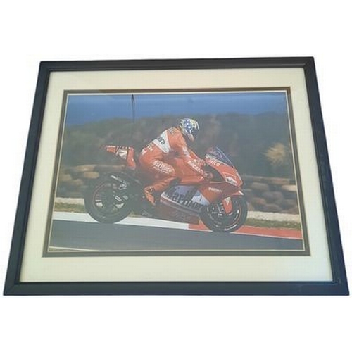68 - Troy Bayliss signed 15x12 inch overall mounted and framed Moto GP colour photo. Good condition Est.