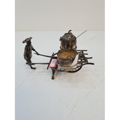 101 - A Chinese silver novelty salt by Hung Chong, of a figure pushing a cart. Condition report: Slight we... 