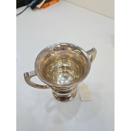 121 - A silver trophy cup of vacant body, hallmarked Birmingham 1925. Alexander Clark and Co Ltd. 4.07ozt ... 