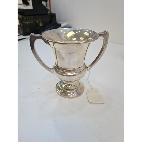 121 - A silver trophy cup of vacant body, hallmarked Birmingham 1925. Alexander Clark and Co Ltd. 4.07ozt ... 