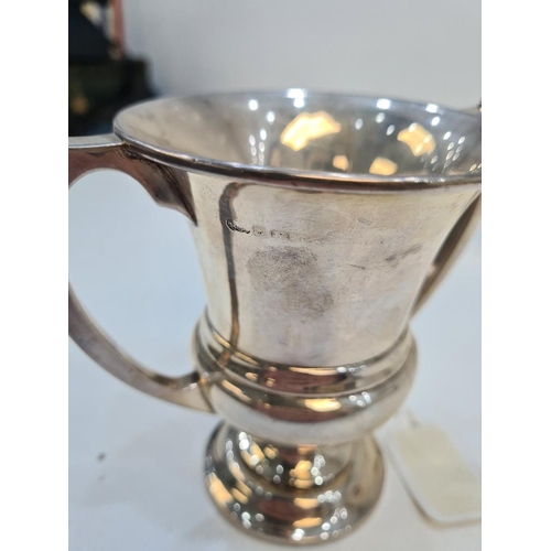 121 - A silver trophy cup of vacant body, hallmarked Birmingham 1925. Alexander Clark and Co Ltd. 4.07ozt ... 