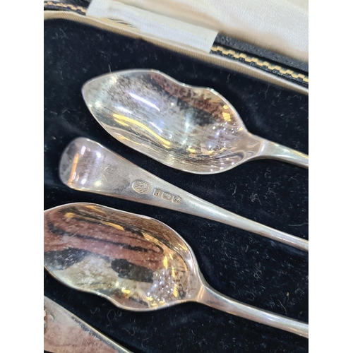 128 - A cased set of grapefruit spoons with pretty embossed terminals, hallmarked Sheffield 1932, Alexande... 