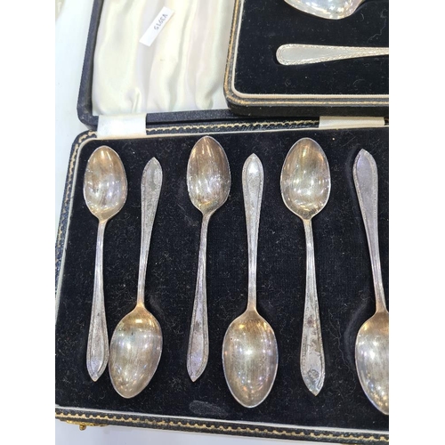 130 - A cased silver christening set of a fork and spoon by William Suckling Ltd. With two cased sets of t... 