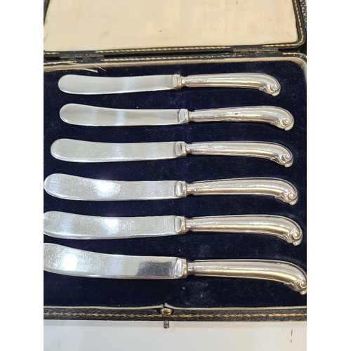 14 - A cased set of silver handled knives by C H Beason, Sheffield 1931, with another cased set by Yates ... 