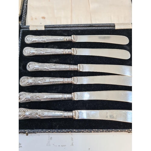 14 - A cased set of silver handled knives by C H Beason, Sheffield 1931, with another cased set by Yates ... 