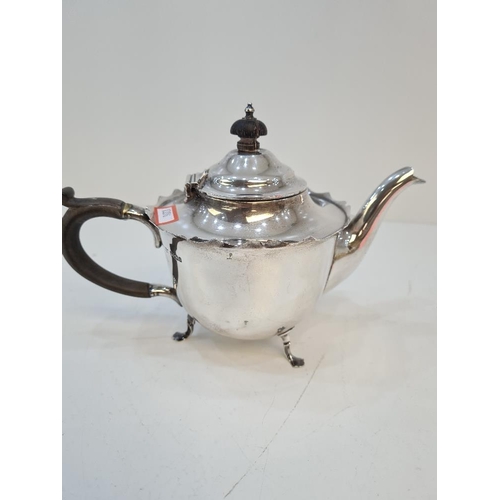 145 - A silver teapot having decorative rim and on three pretty feet, by Mappin and Webb. Hallmarked Sheff... 