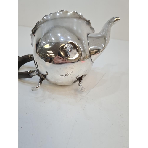 145 - A silver teapot having decorative rim and on three pretty feet, by Mappin and Webb. Hallmarked Sheff... 