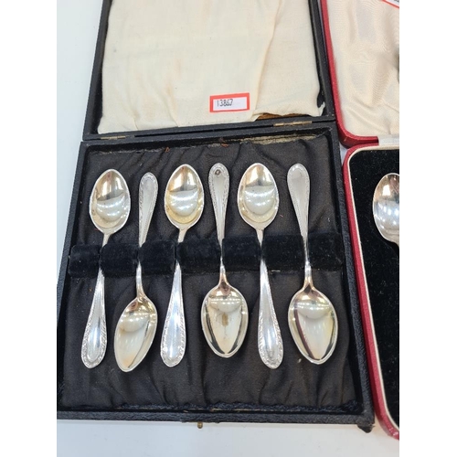 15 - Cased Continental silver teaspoons, spoons marked 800, having half gadrooned borders. Also with case... 