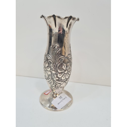 16 - A silver Victorian vase having floreated embossed body, petal design rim and a domed circular foot. ... 