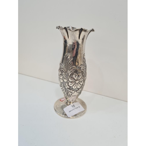 16 - A silver Victorian vase having floreated embossed body, petal design rim and a domed circular foot. ... 