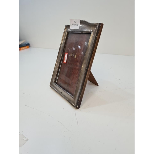 17 - A silver photo frame of rectangular form, 18cm high approx. Hallmarked Chester 1915. Maker's mark wo... 