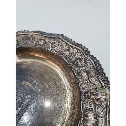 28 - A heavy silver Edwardian dish having thoroughly decorated embossed details of lions, shells and flor... 