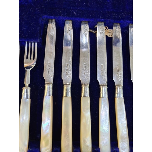 37 - A superb cased silver and Mother of Pearl cutlery set. Ornate details on the blade, hallmarked Sheff... 