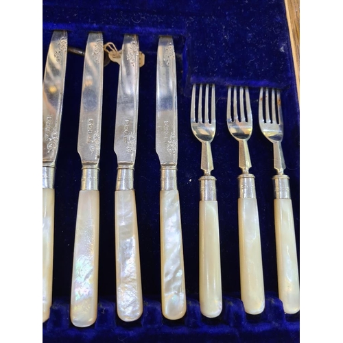 37 - A superb cased silver and Mother of Pearl cutlery set. Ornate details on the blade, hallmarked Sheff... 