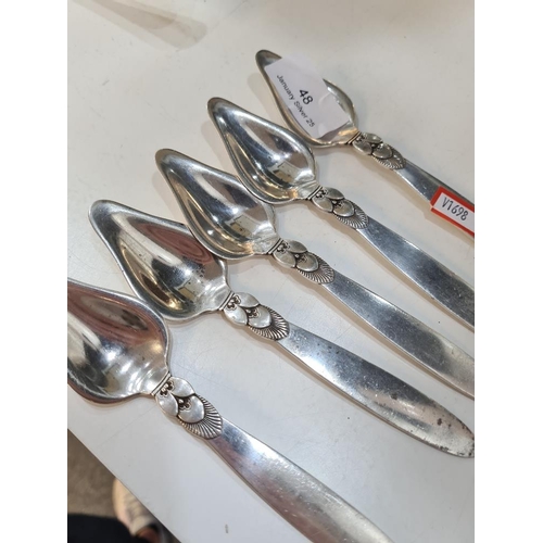 48 - Georg Jensen Ltd. Five quality Georg Jensen silver Danish spoons hallmarked with the London import m... 