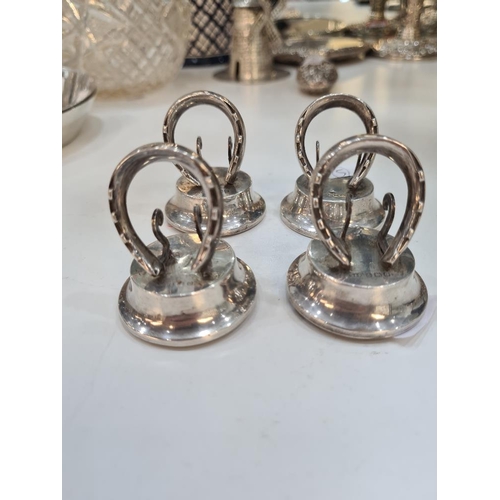 51 - A set of four silver menu holders, of novelty design of horseshoe. Hallmarked Birmingham 1913 Levi a... 