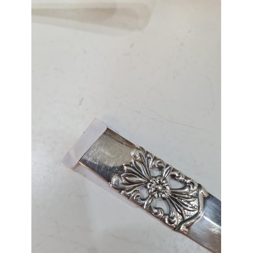 71 - A decorative silver letter opener having pierced floral design, hallmarked Birmingham 1998 Victoria ... 