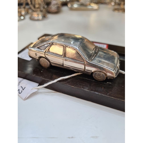 72 - A silver miniature car, on a stand, hall marked London 1983, maker unknown. Condition report: No obv... 