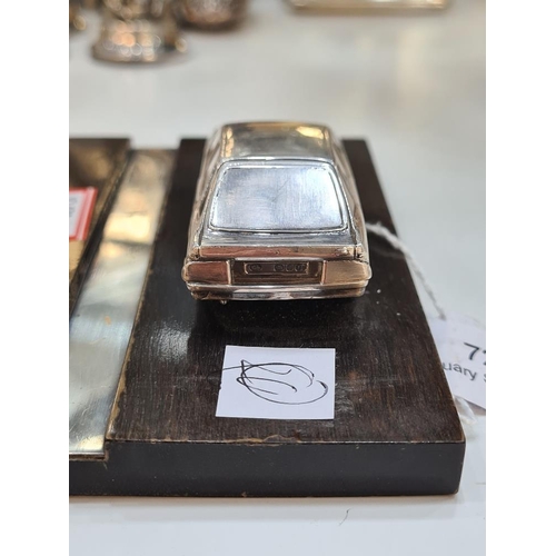 72 - A silver miniature car, on a stand, hall marked London 1983, maker unknown. Condition report: No obv... 