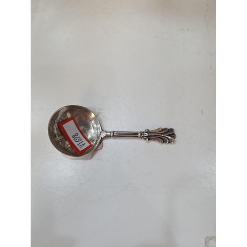 75 - A Georgian silver caddy spoon having pretty, decorative handle and engraved bowl. Hallmarked Birming... 