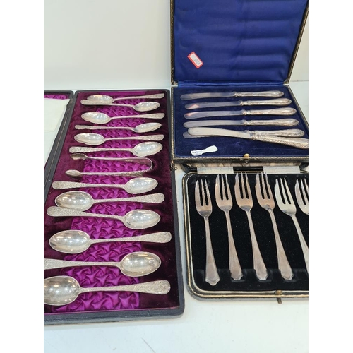 91 - Silver handled knives, silver cake forks and a set of decorative silver teaspoons and tongs having e... 