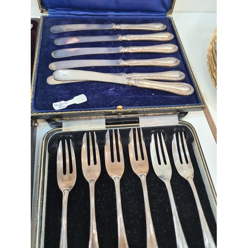 91 - Silver handled knives, silver cake forks and a set of decorative silver teaspoons and tongs having e... 