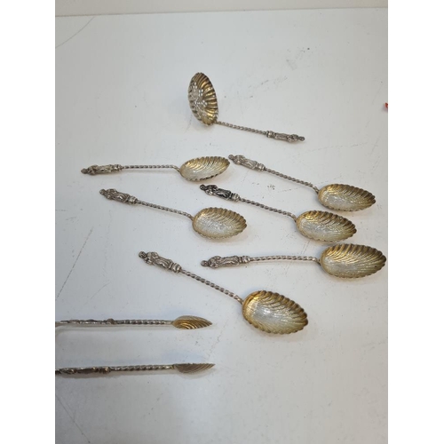 97 - A very pretty set of Victorian silver scallop gilt Apostle spoons having Wrythen handles, with match... 