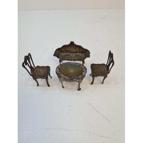 98 - A silver miniature table and chairs by David Hollander and Son, Birmingham 1981. Comprising a sofa s... 