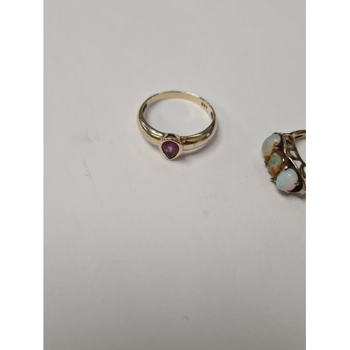 1003 - 9ct yellow gold band ring with central pear shaped garnet in rubover setting, marked 9ct, size R, 2.... 