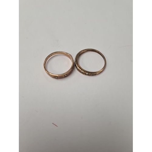 1022 - Two 9ct band rings inset with cubic zirconia stones, both marked 375, sizes O + R, 3.9g approx