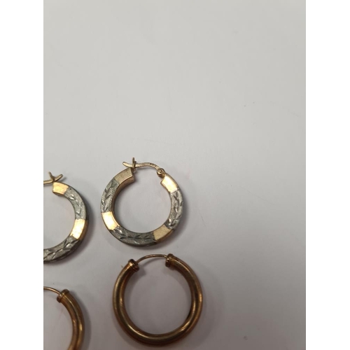 1028 - Two pairs of 9ct gold hoop earrings, one pair of two tone gold etched hoops and the other yellow gol... 