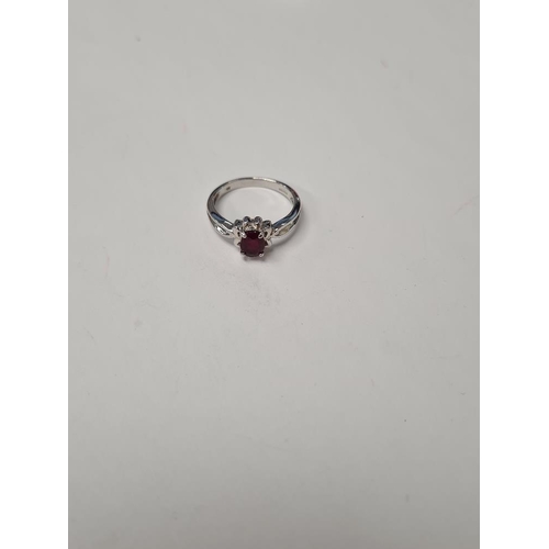 1032 - 9ct white gold dress ring with oval faceted ruby, marked 375, size o, approx 3.2g