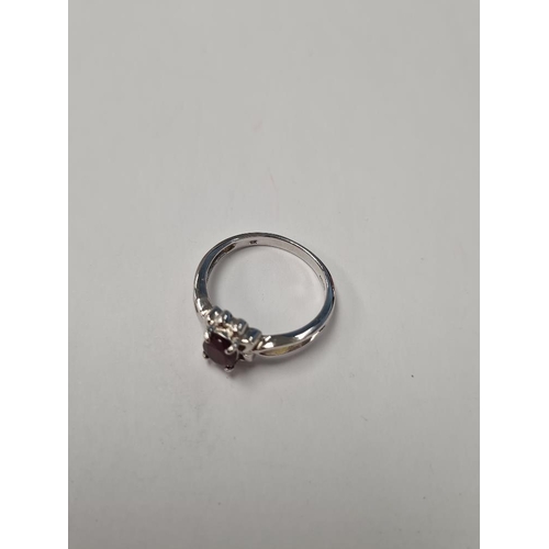 1032 - 9ct white gold dress ring with oval faceted ruby, marked 375, size o, approx 3.2g