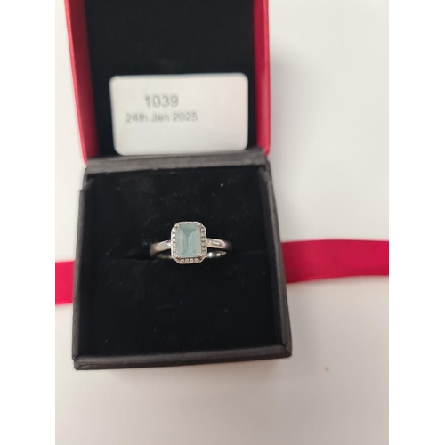 1039 - Contemporary 18ct white gold dress ring with central step cut rectangular aquamarine in 4 claw mount... 