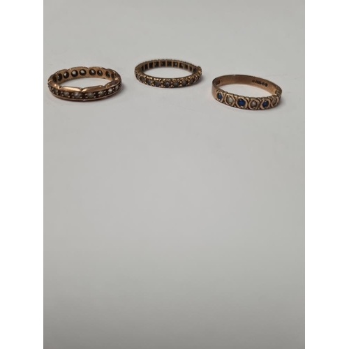 1055 - Three 9ct gold rings, 2 eternity styles (one AF) and a half hoop glass set example, 2 marked 9ct, on... 