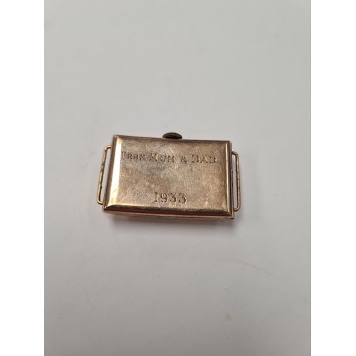 1058 - 9ct rose gold watch head, rectangular curved form, marked 375, inscribed to verso 'From Mum & Dad 19... 