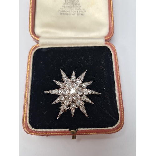 1076 - An antique Victorian gold, silver and graduating old cut diamond Starburst brooch, with yellow metal... 