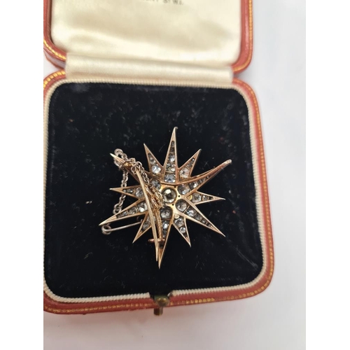 1076 - An antique Victorian gold, silver and graduating old cut diamond Starburst brooch, with yellow metal... 