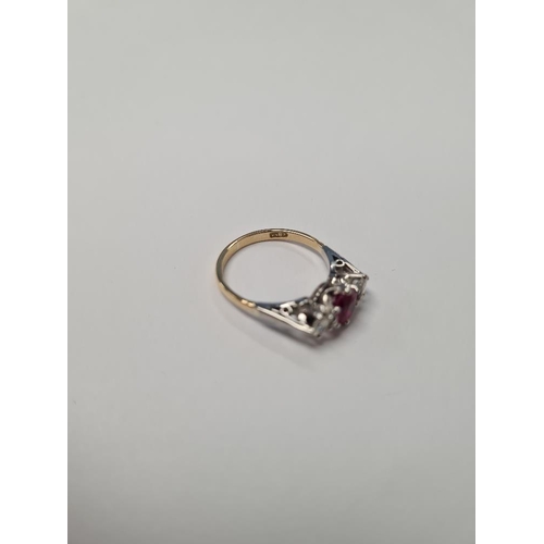 1087 - Mid Century Ruby and Diamond trilogy ring with central oval cut ruby 6.8 mm x 5.5mm, and two old bri... 