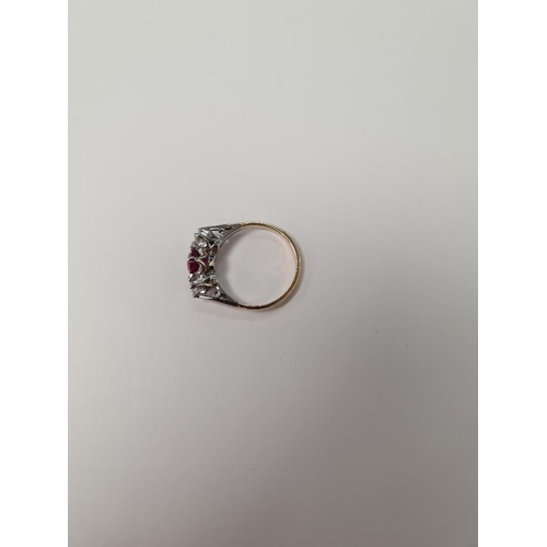 1087 - Mid Century Ruby and Diamond trilogy ring with central oval cut ruby 6.8 mm x 5.5mm, and two old bri... 