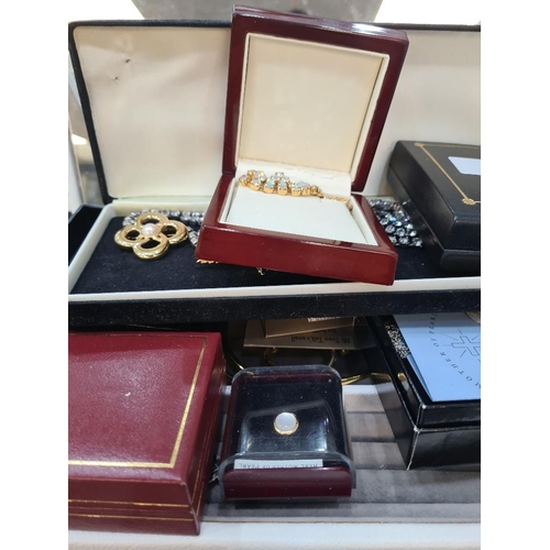 1102 - Jewellery box containing plated bangles, coins, opal brooch etc 