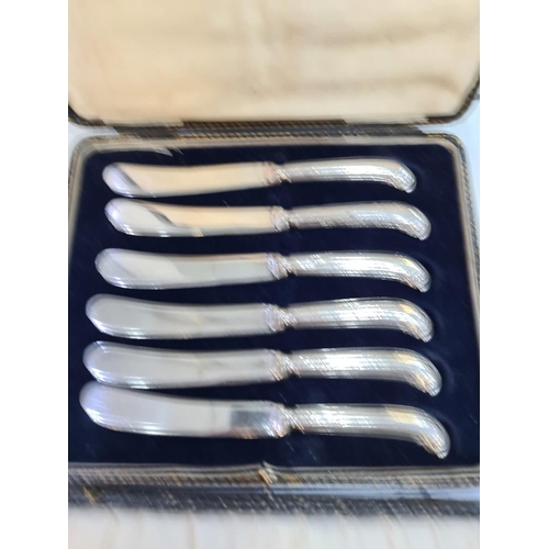 1119A - A cased set of silver handled knives by C H Beason, Sheffield 1931, with another cased set by Yates ... 