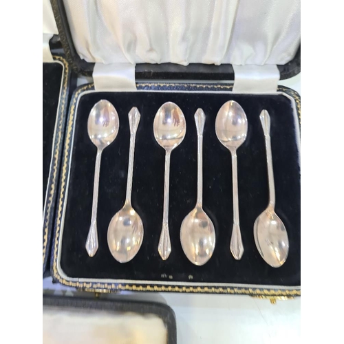 1124 - A cased silver christening set of a fork and spoon by William Suckling Ltd. With two cased sets of t... 