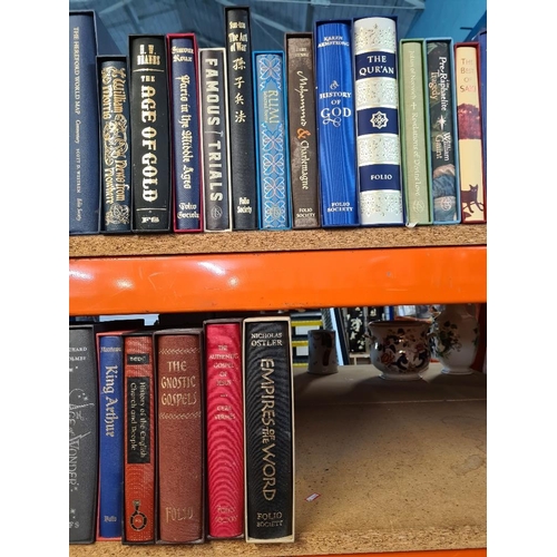 1152 - A quantity of Good folio society books, many unused titles such as 'The Holkham Bible' and 'The Qu'r... 