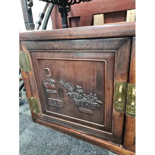 1192 - Chinese 2 door cabinet with panels of carved vases and flowers, 133.5cm circa 1900